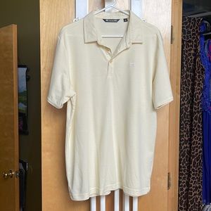 Soft yellow Travis Mathew’s golf shirt